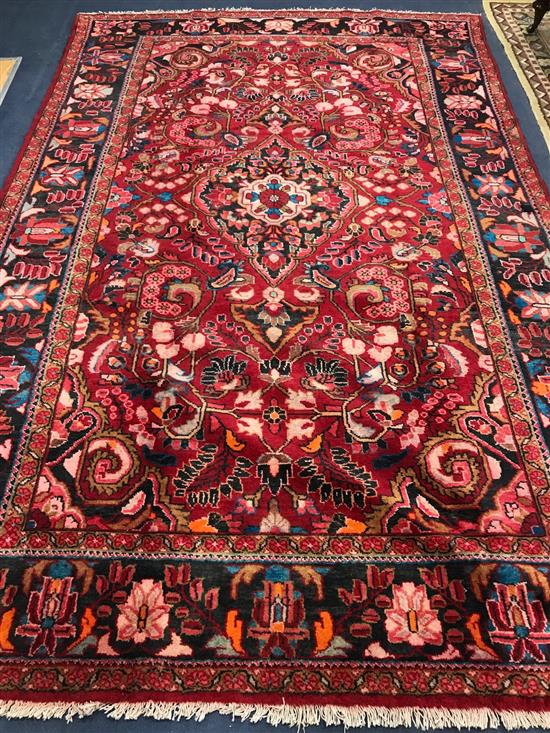 A Lilian red ground carpet 340 x 225cm